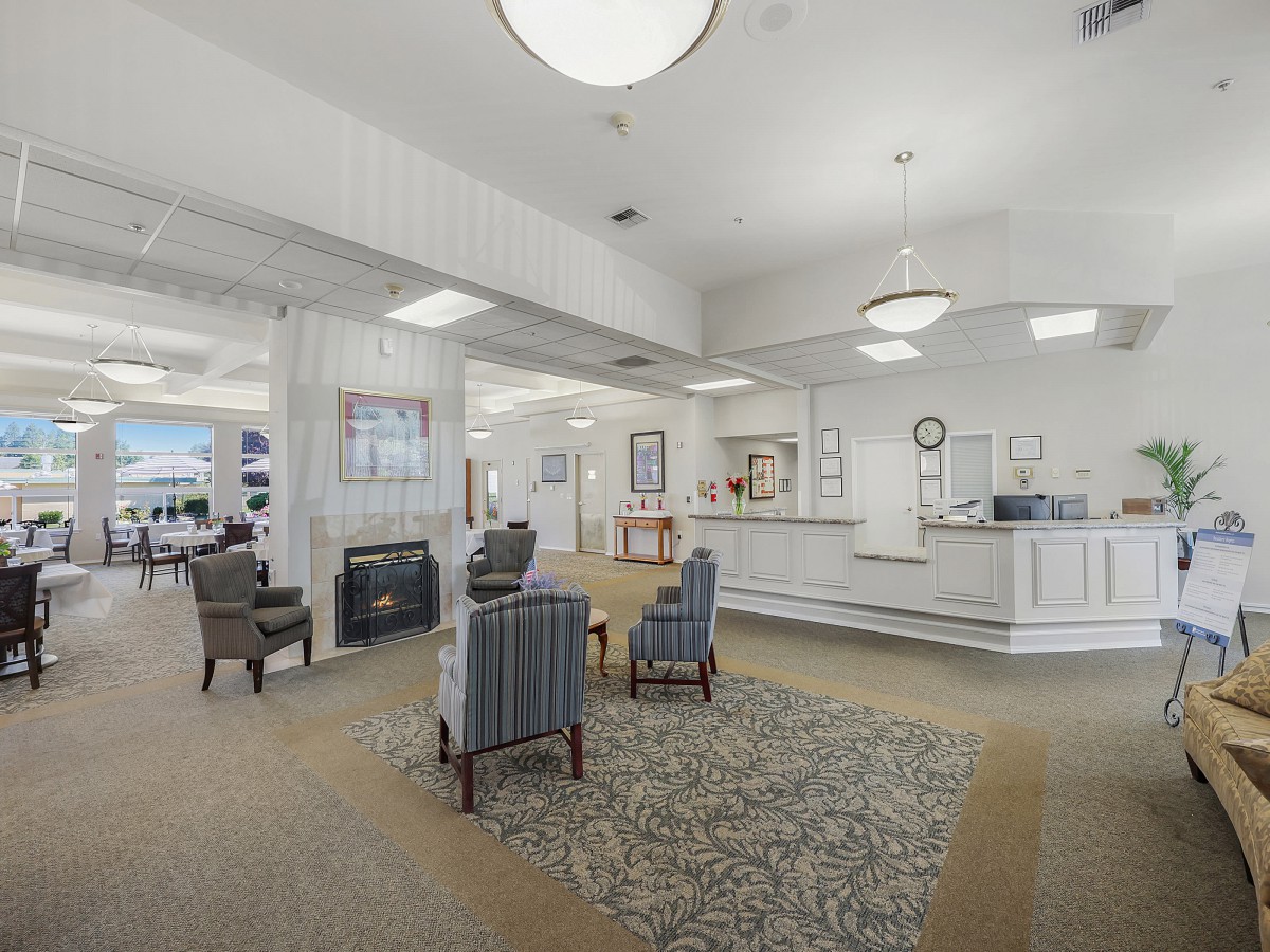 A bright and inviting lobby with comfortable seating and a reception desk.
