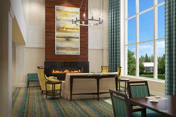 A modern lobby with a cozy seating area around a fireplace.