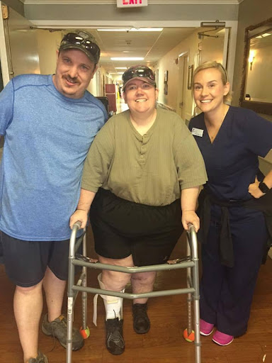 A moment of triumph: celebrating progress in rehabilitation with supportive friends.