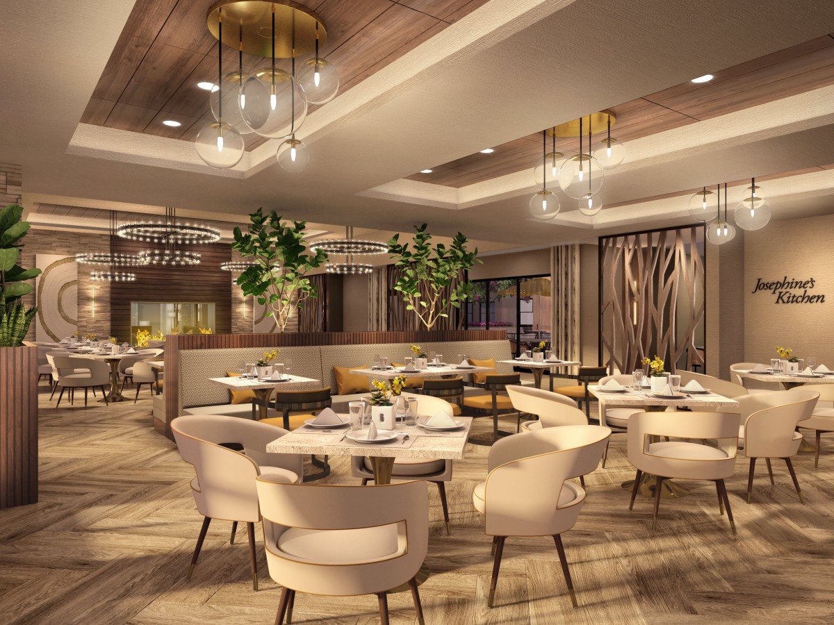 An elegant and modern restaurant interior with stylish chandeliers and comfortable seating.