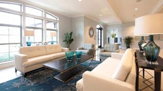 A modern living room with sleek furniture and stylish decor.