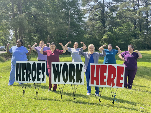 Healthcare professionals proudly celebrating their dedication with a powerful message.