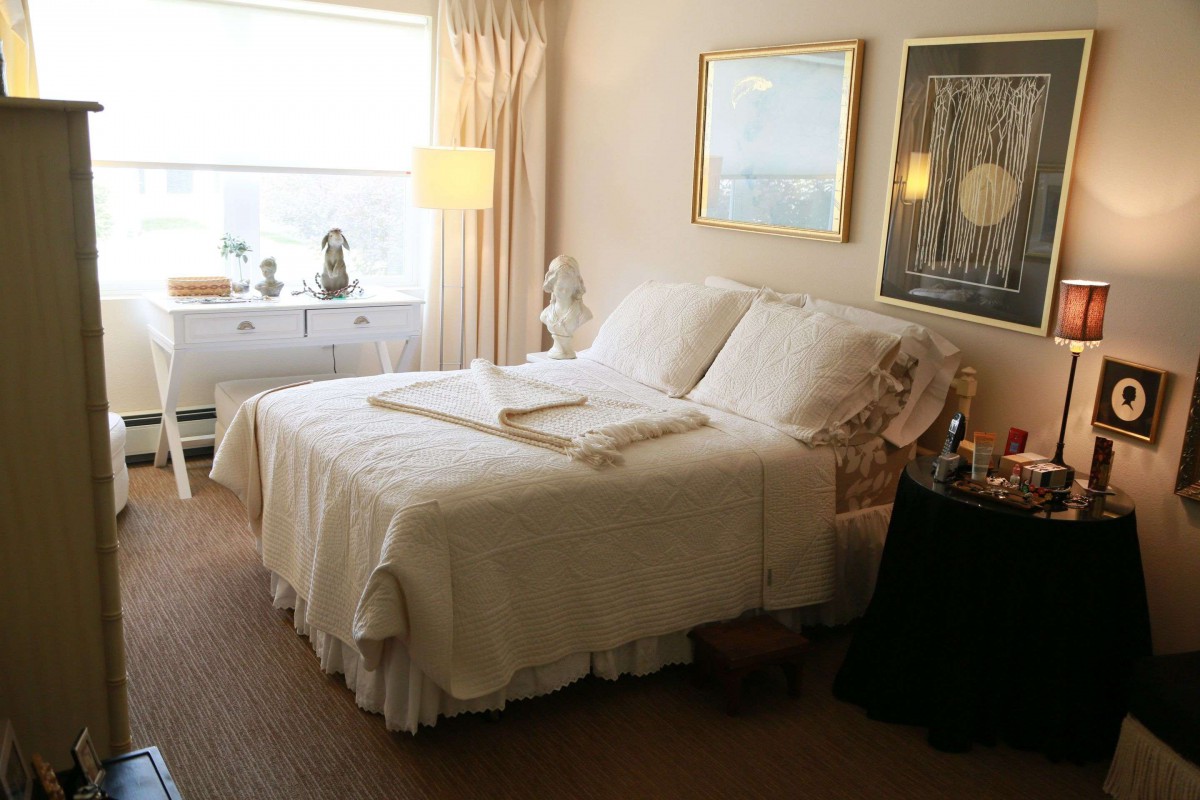 A cozy bedroom with elegant decor and soft lighting.