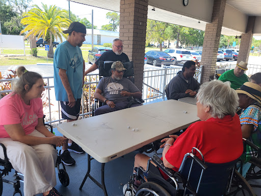 A group of people enjoying games and socializing outdoors.