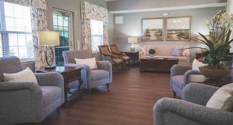 A cozy living room featuring comfortable seating and elegant decor.