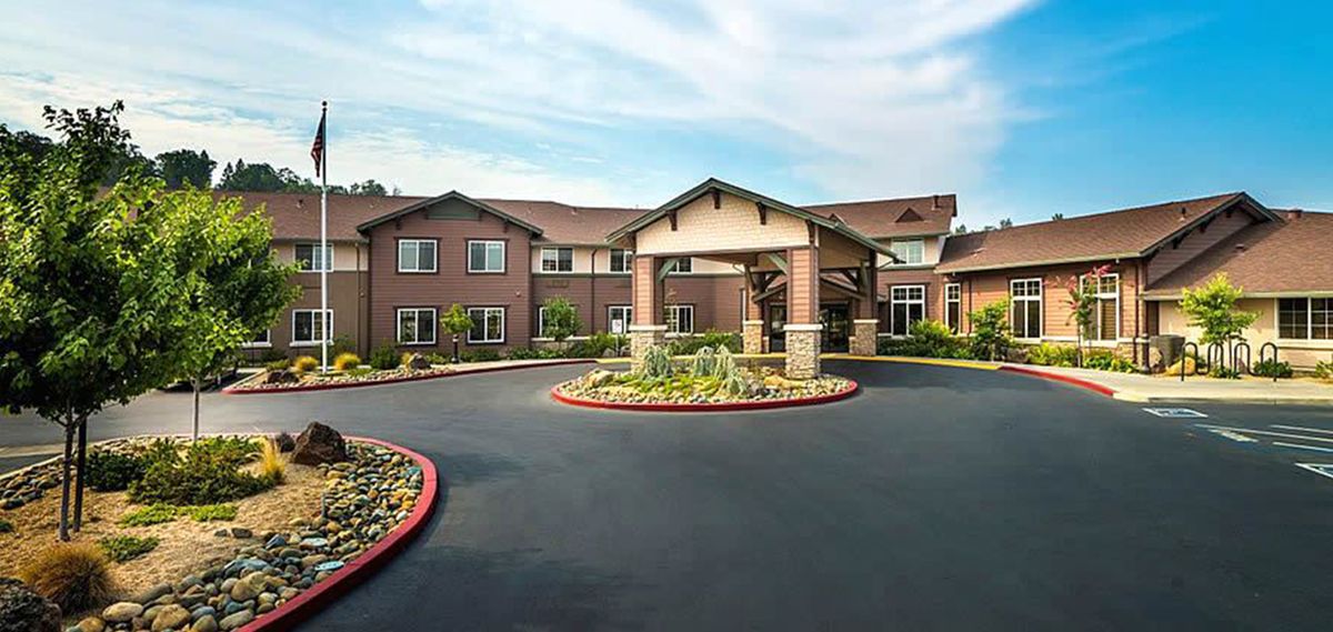 A well-maintained residential building with a landscaped entrance.
