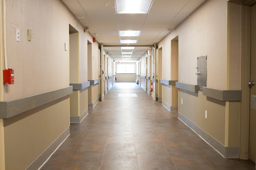 A well-lit hospital hallway showcasing a clean and organized healthcare environment.