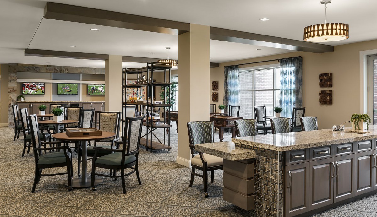 A modern dining area with tables, chairs, and stylish decor.
