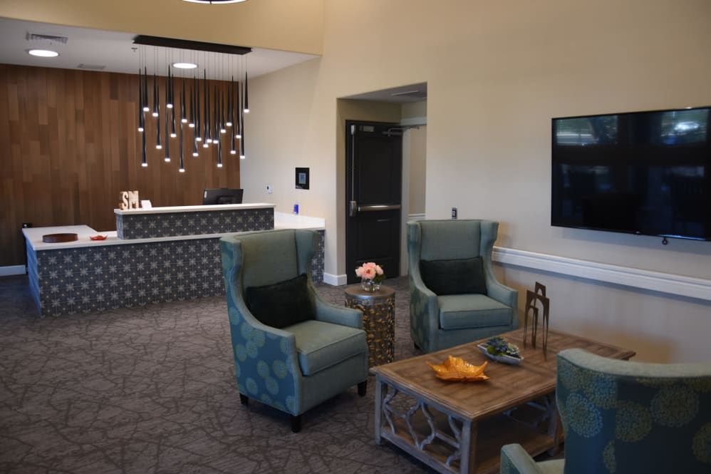 A modern lobby with comfortable seating and a stylish reception desk.