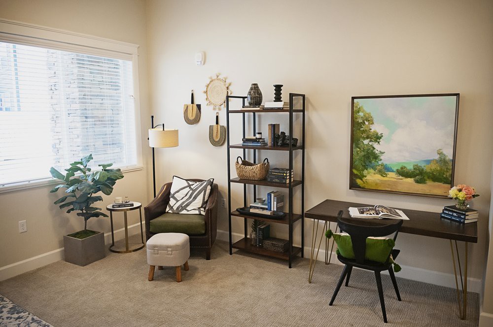 A modern living room with stylish furniture and decorative accents.