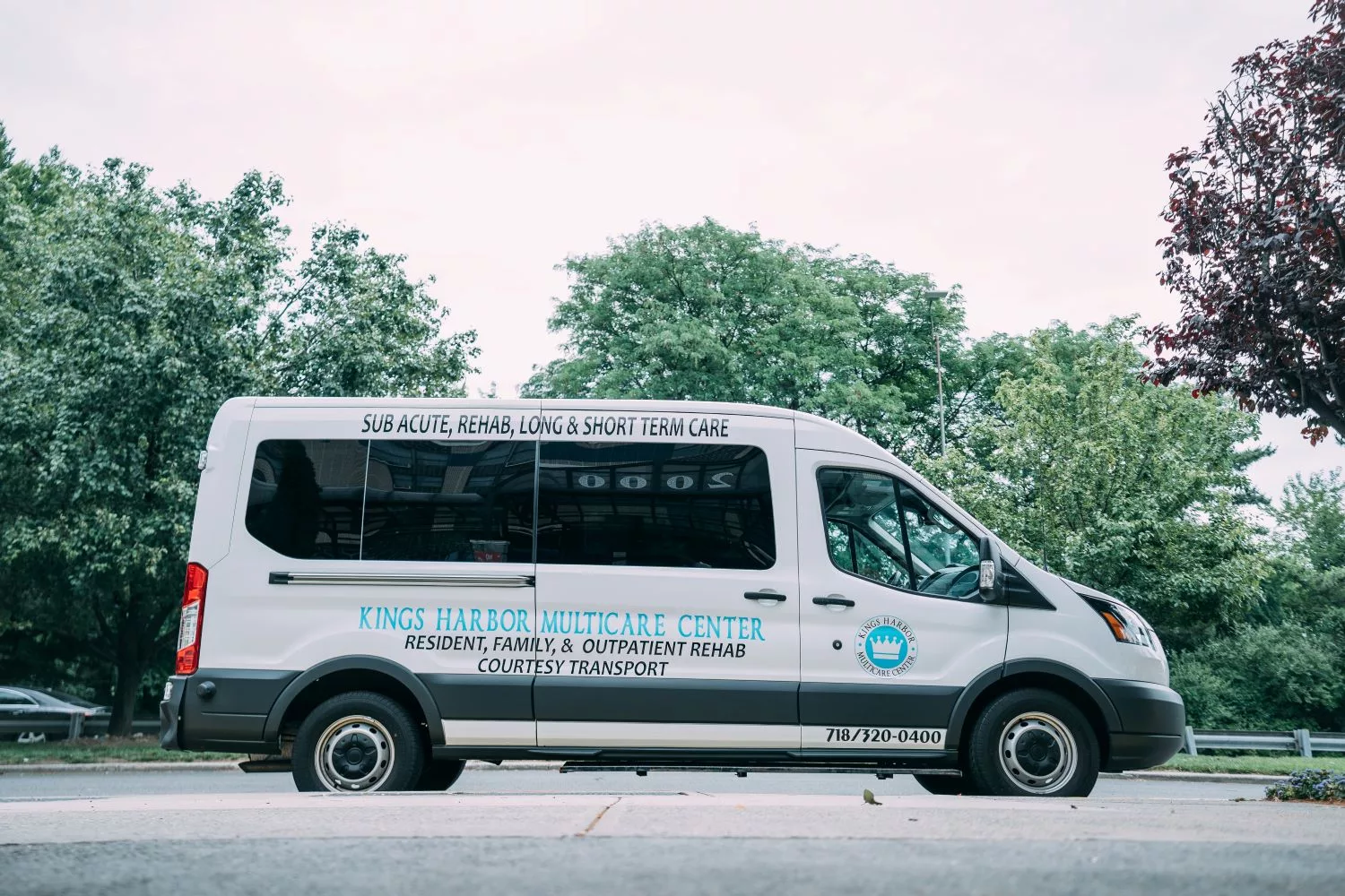A city service van parked on the side of the road.