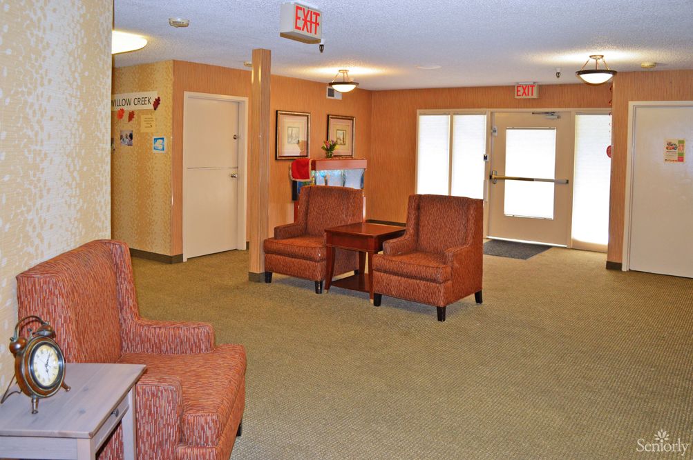 A cozy lobby with comfortable seating and warm lighting.