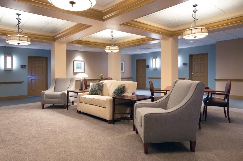 A hotel lobby with comfortable seating and elegant lighting.