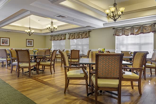 An elegant dining room with classic decor and ample seating.