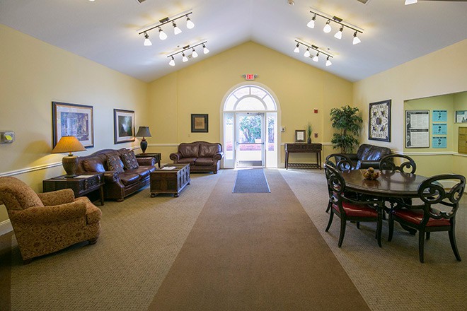 A well-lit lobby with comfortable seating and elegant decor.