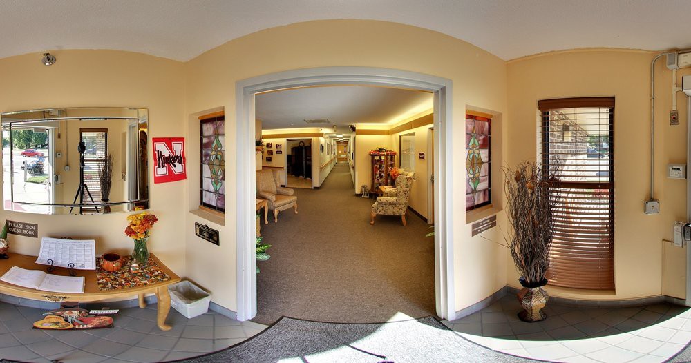 A welcoming hallway with archway entrance and cozy decor.