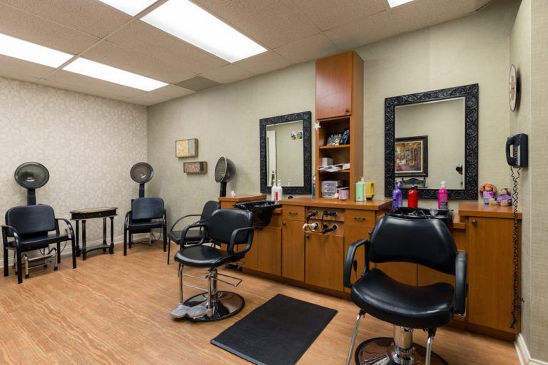 A well-organized hair salon with styling chairs and mirrors.