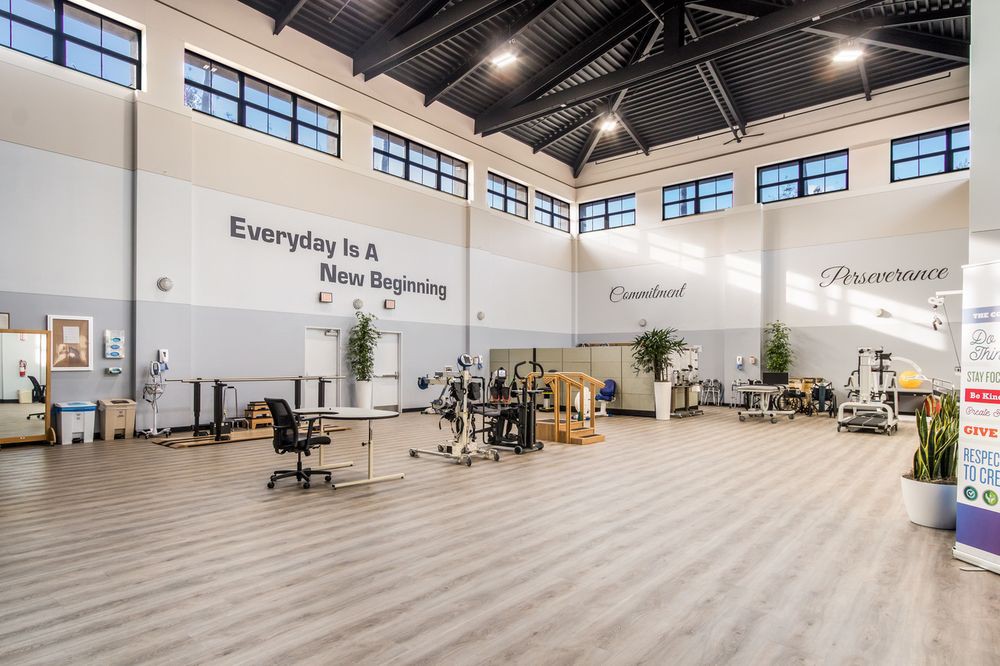 A spacious modern workspace with high ceilings and industrial-style design.