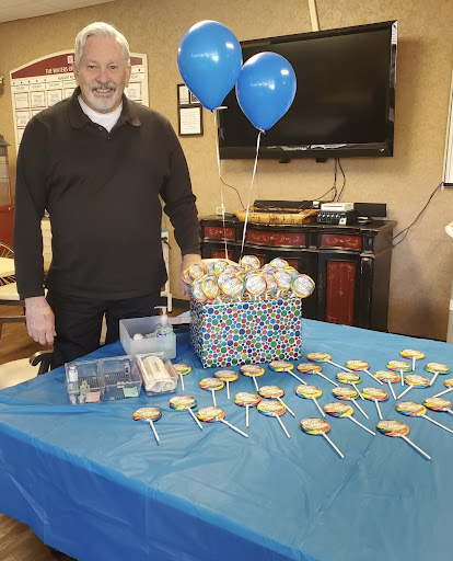 A festive setup featuring balloons and a variety of cookies, ready for a celebration.