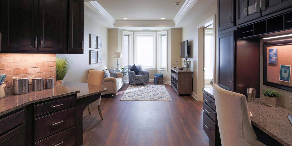 A cozy living room with comfortable seating, natural light, and elegant decor.