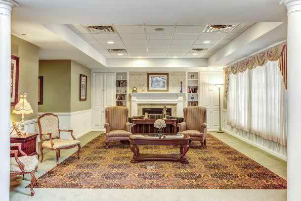 A cozy living room with a fireplace and comfortable seating.