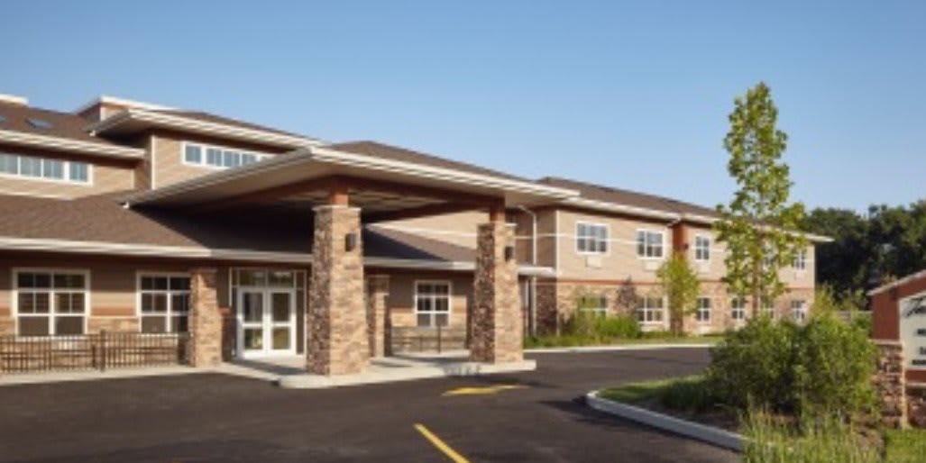Modern commercial building with a canopy entrance.
