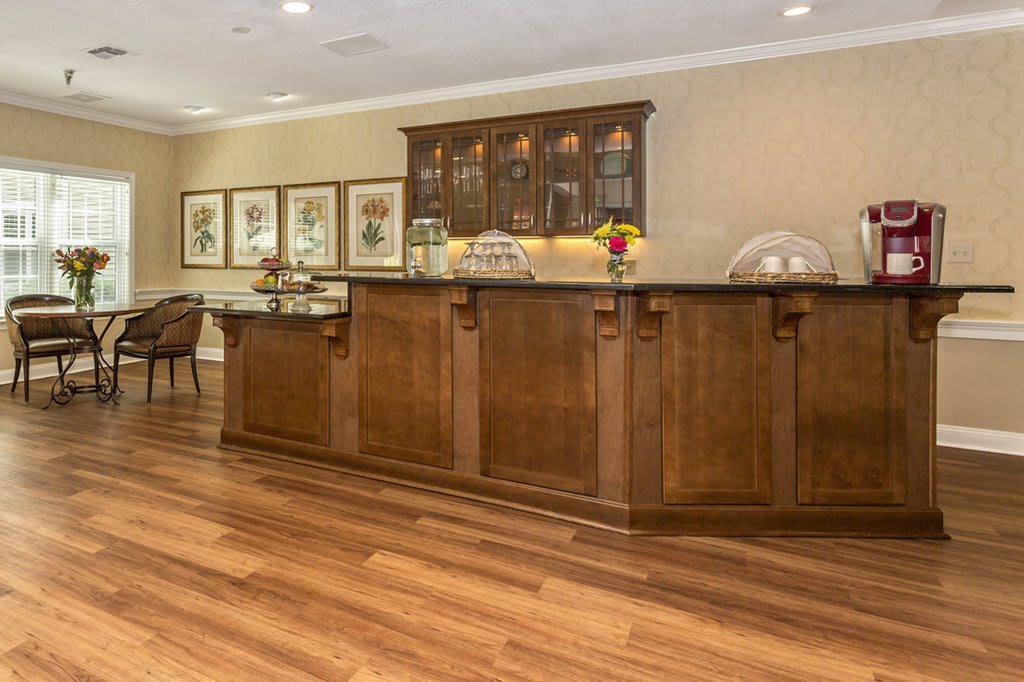A well-appointed reception area featuring a wooden counter and decorative elements.