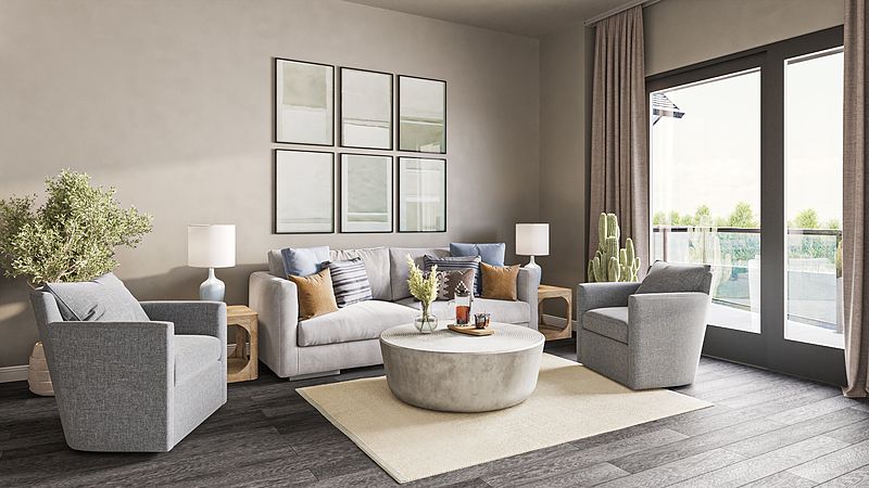 A modern living room with neutral tones, featuring comfortable sofas and a round coffee table.