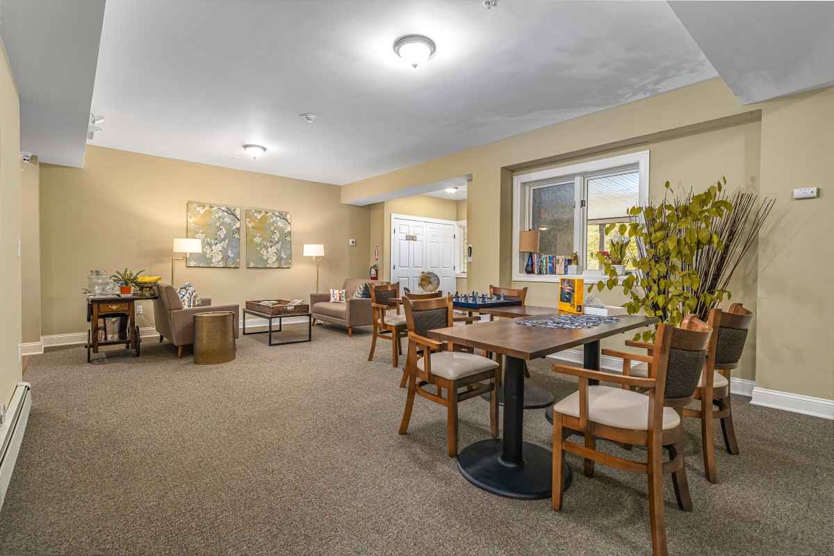 A cozy living room with comfortable seating and warm lighting.