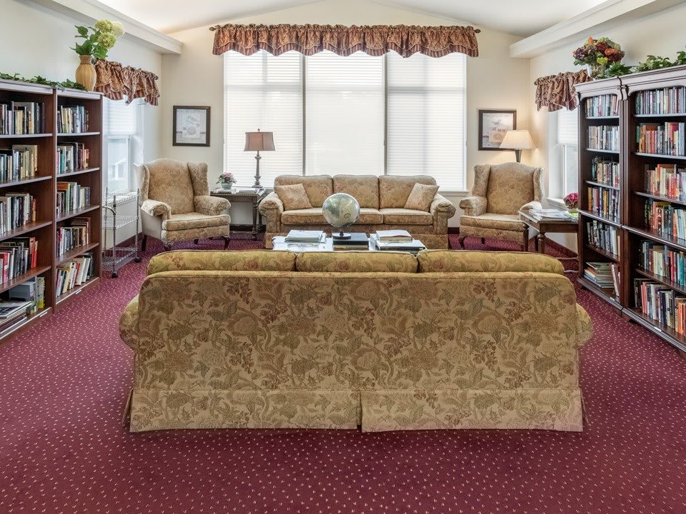 A cozy living room with elegant furniture and warm lighting.