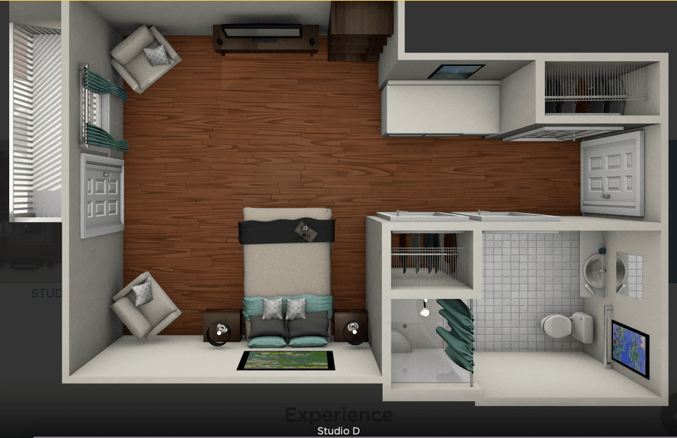 An overhead view of a compact apartment floor plan featuring a bedroom, living area, and bathroom.