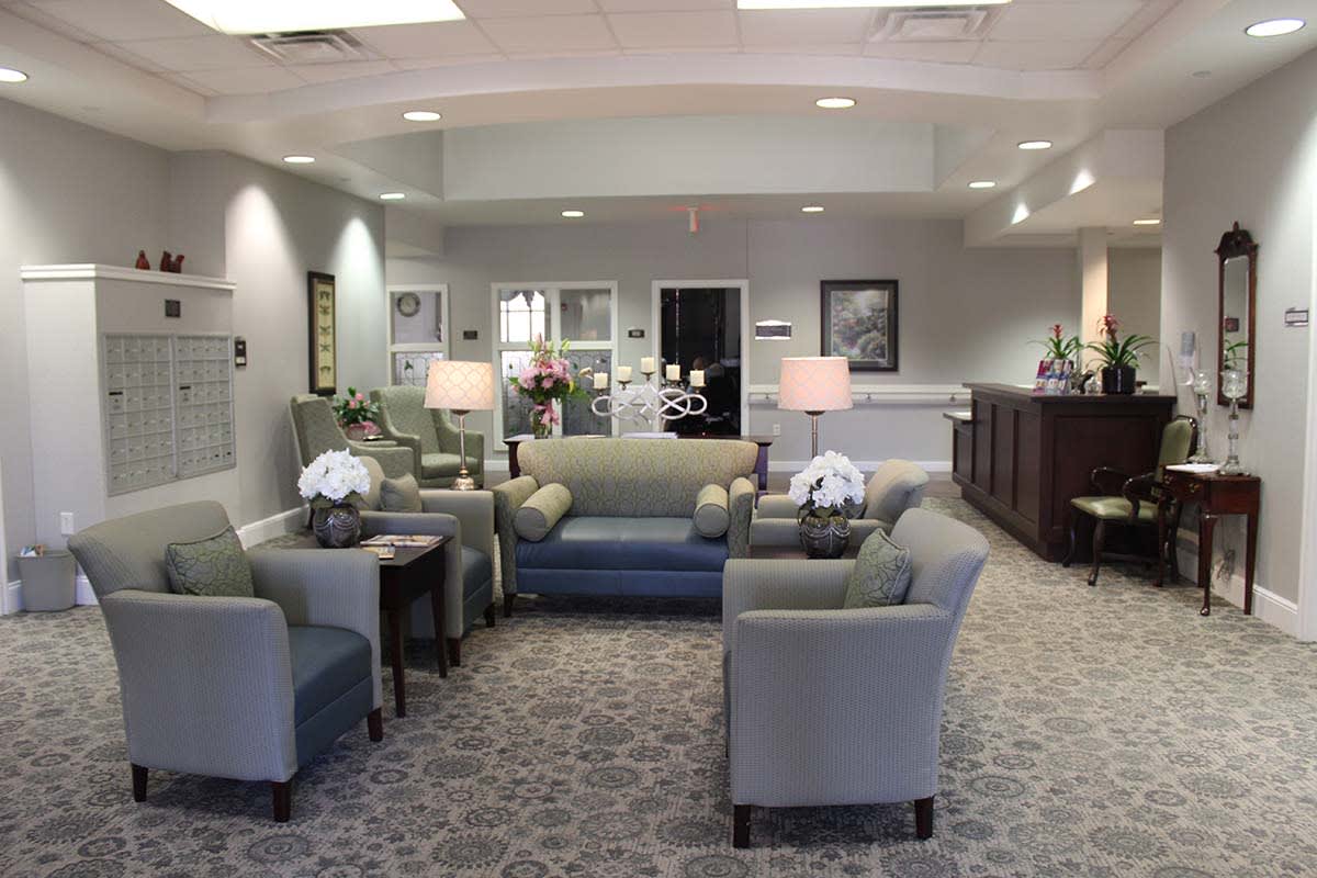 A modern waiting room with comfortable seating and elegant decor.