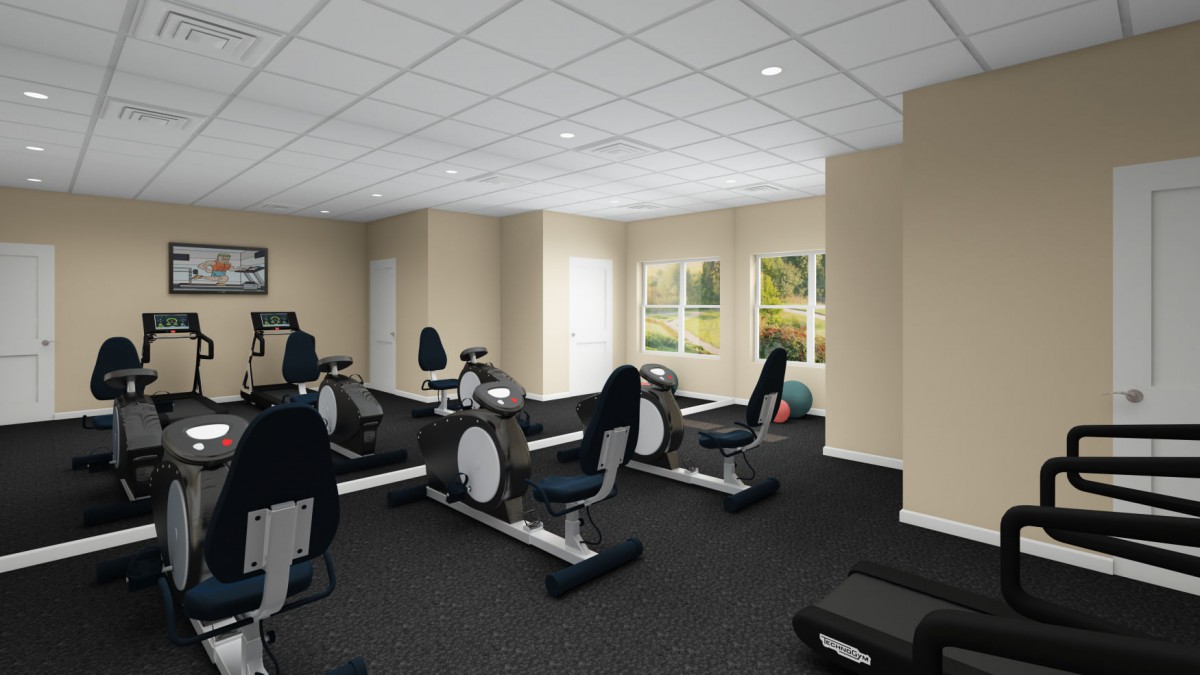 A modern fitness center with stationary bikes and exercise equipment.