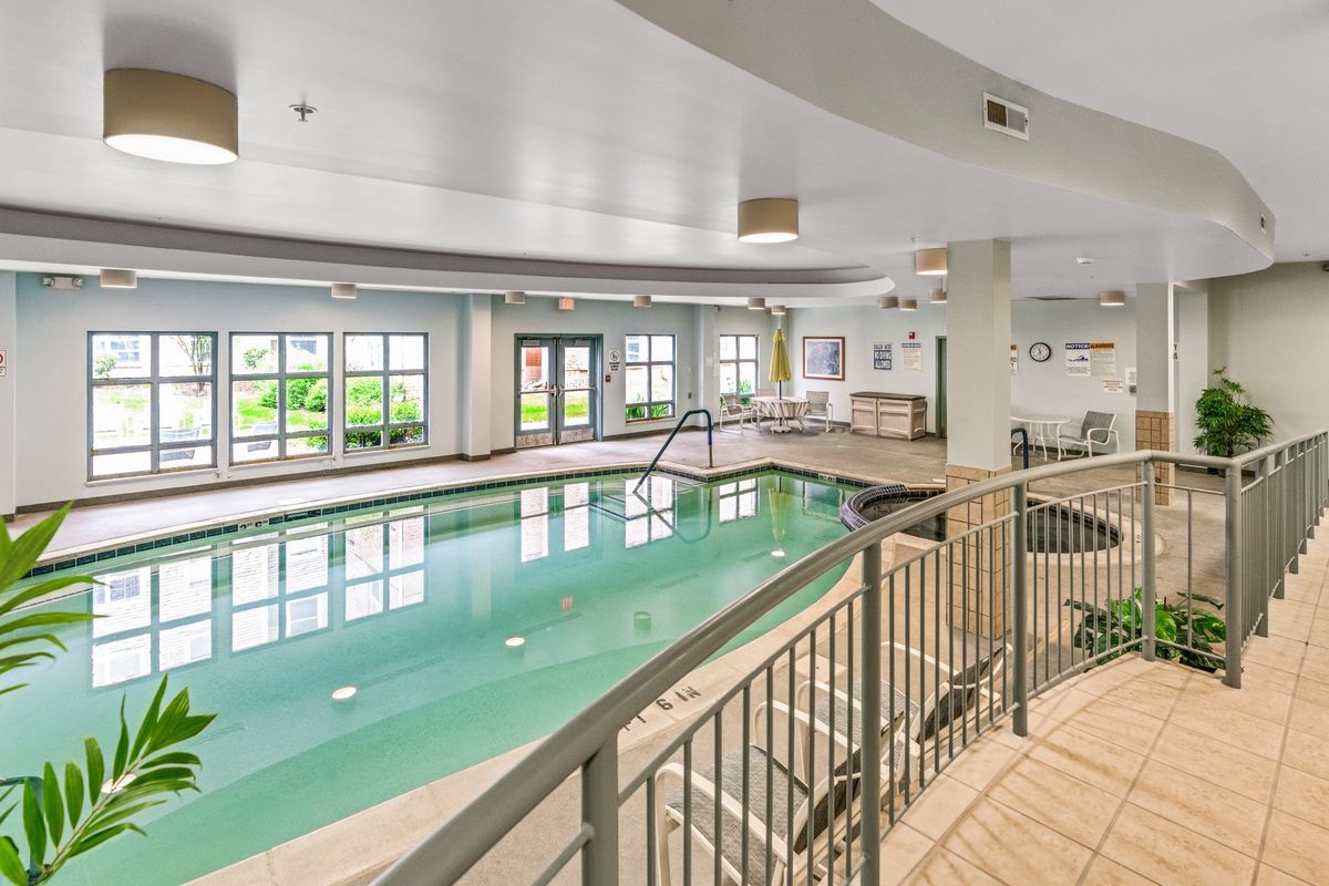 An indoor swimming pool area in a hotel, providing a relaxing and leisure-friendly environment.