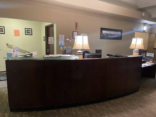 A view of a modern reception desk in an office setting.