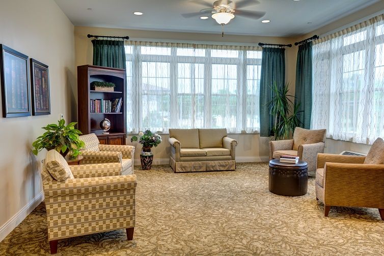 A cozy living room with comfortable seating and a large window.