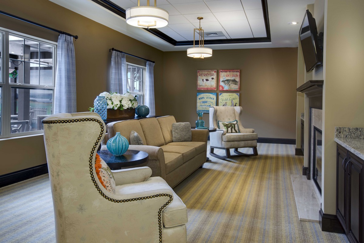 A cozy living room with elegant furniture and warm lighting.