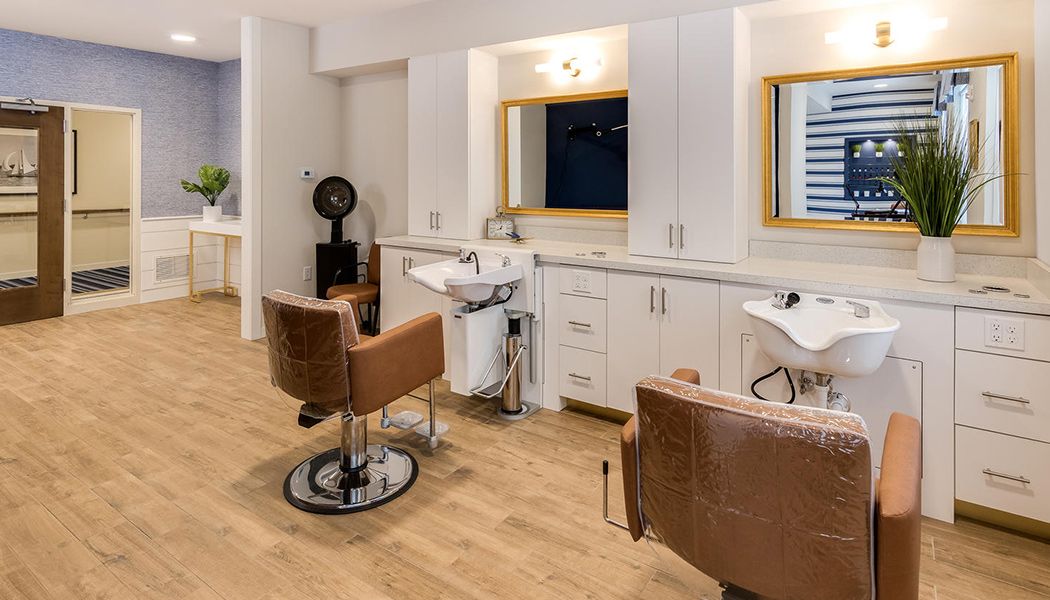 A modern hair salon with styling chairs and mirrors.
