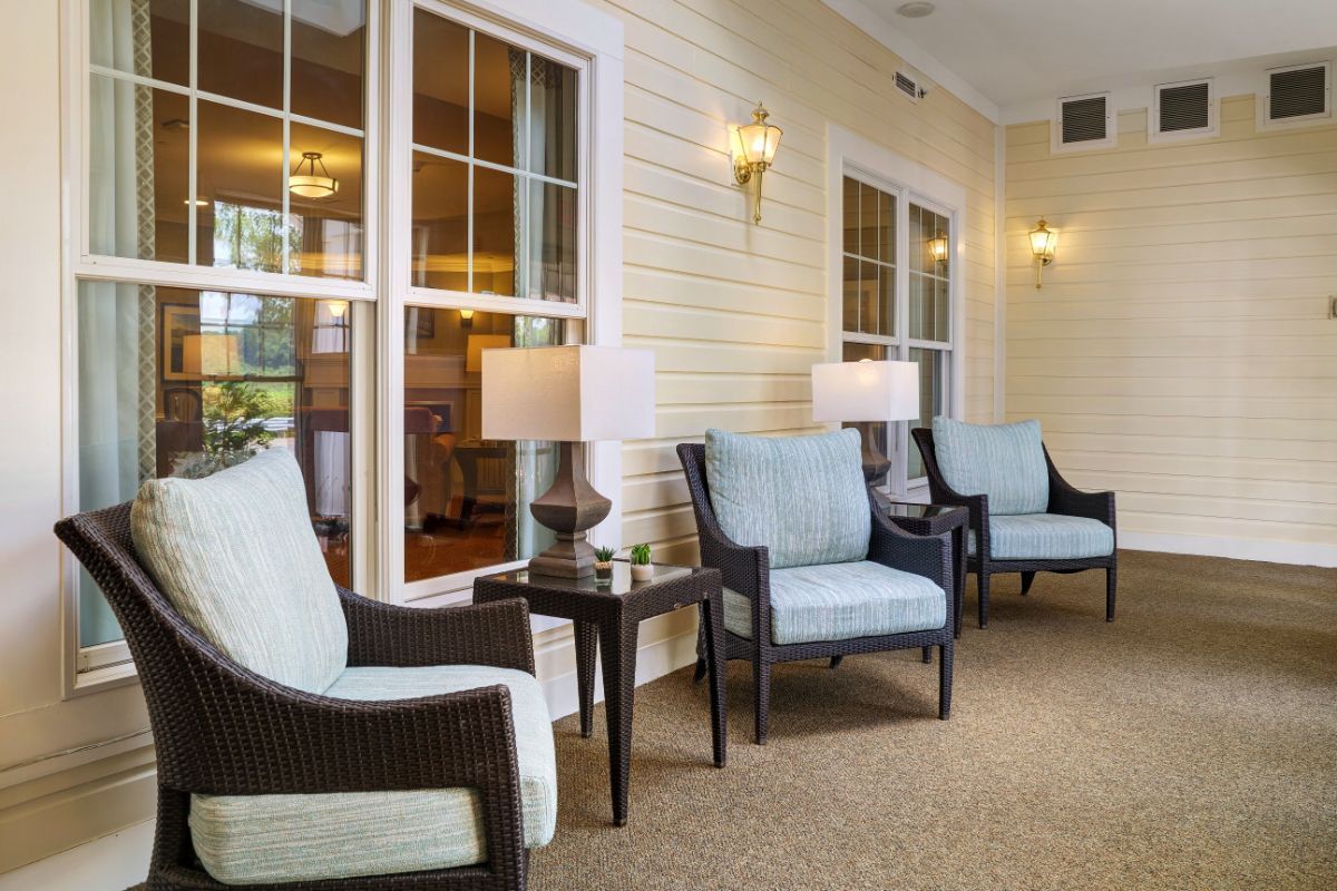 A cozy lounge area with cushioned chairs and warm lighting.