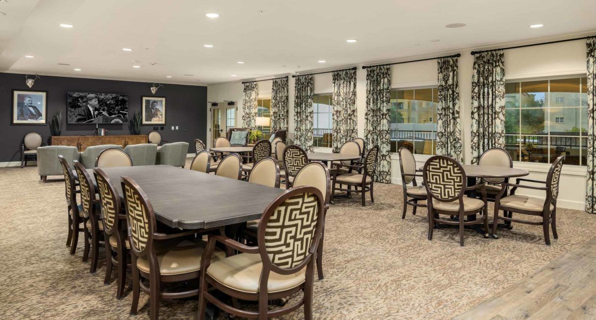 A well-decorated dining room with stylish chairs and tables.