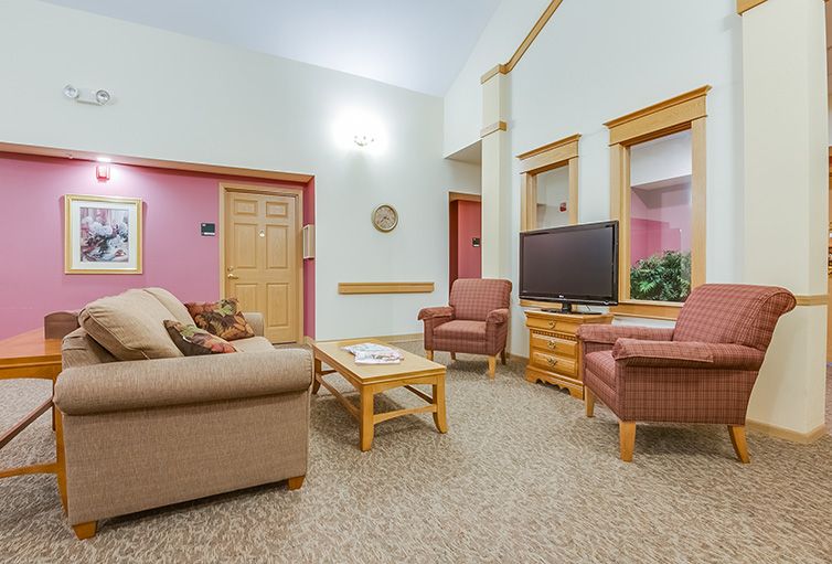 A cozy living room with comfortable seating and a television.