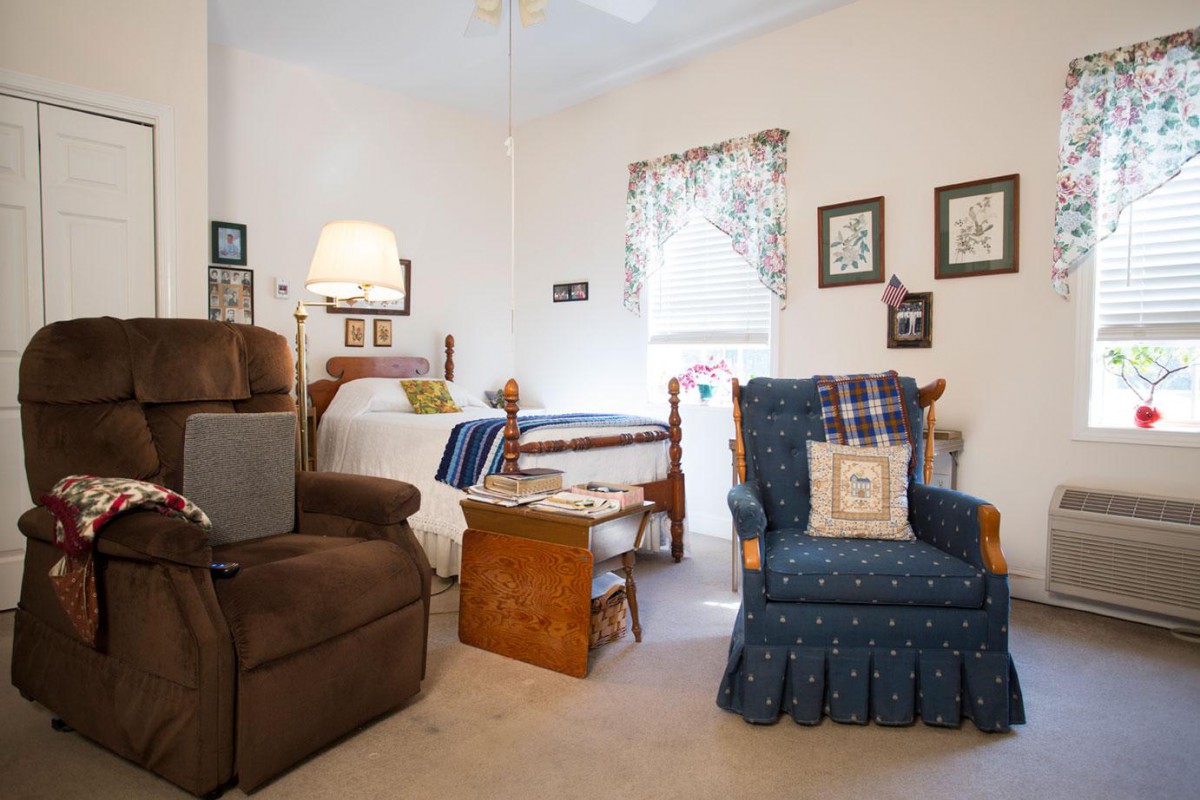 A cozy living room with comfortable chairs and homey decor.
