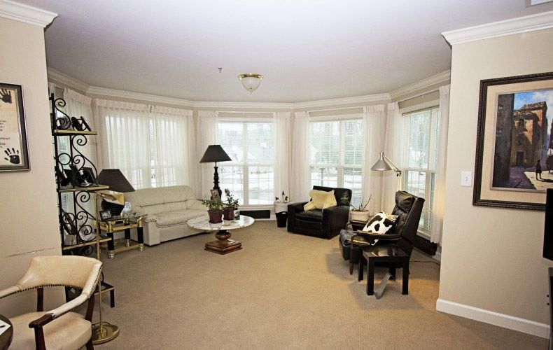 A cozy living room with comfortable seating and ample natural light.
