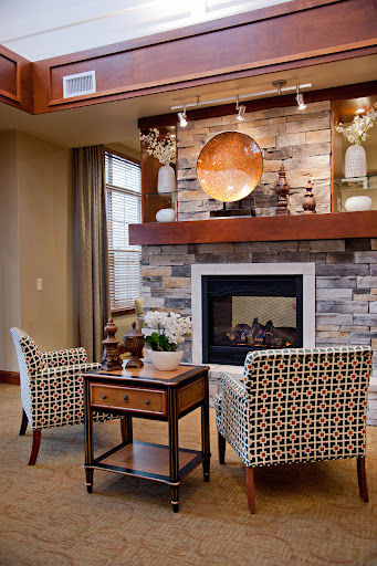 A beautifully designed living room featuring stylish furniture and a warm fireplace.