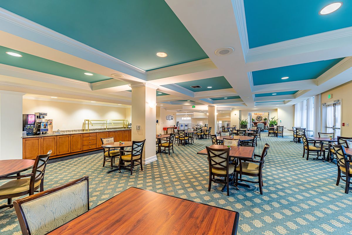 A spacious dining area with modern decor and ample seating.