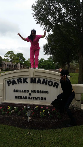 A fun moment captured outside Park Manor, showcasing the playful spirit of two individuals.