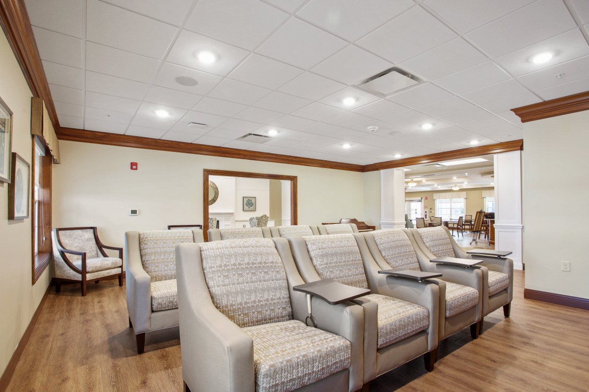 A modern waiting room with comfortable seating and bright lighting.