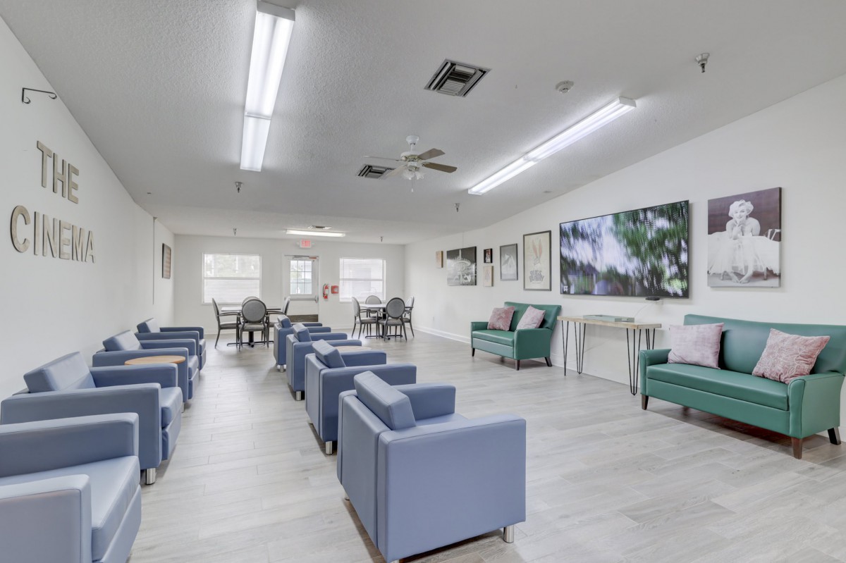 A modern waiting room with comfortable seating and bright lighting.