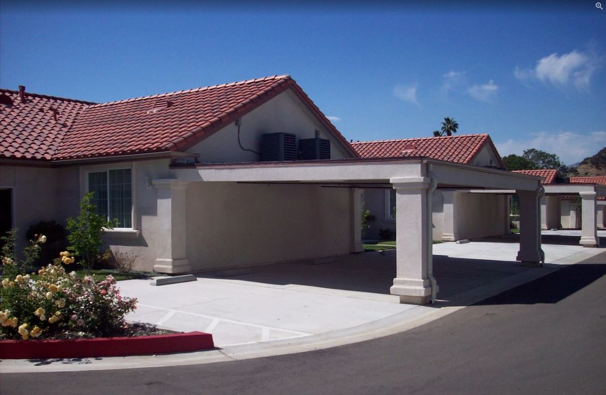 A suburban house with a driveway and covered garage.