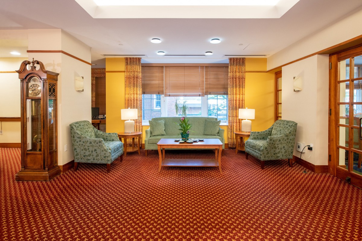 A cozy hotel lobby with comfortable seating and warm lighting.